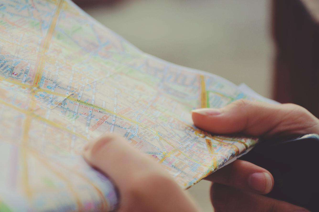 A close up of a person holding a map
