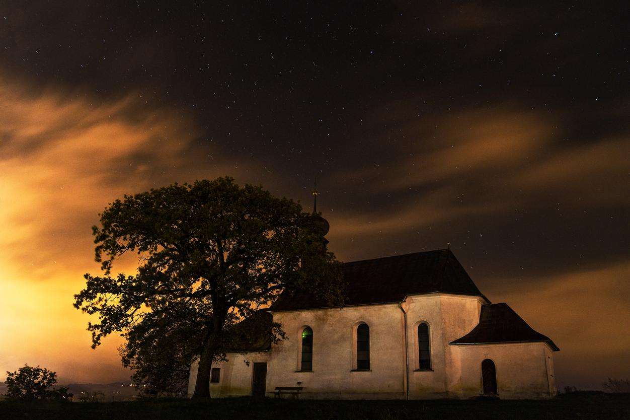 A starry night with a church in the center